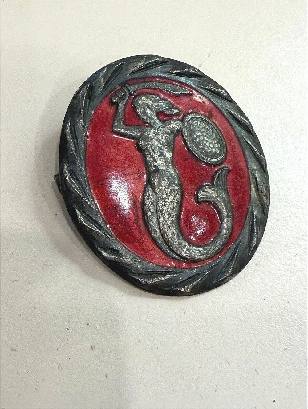 Vintage Warsaw Mermaid Metal Mermaid Shield Pin with Red Enamel Background